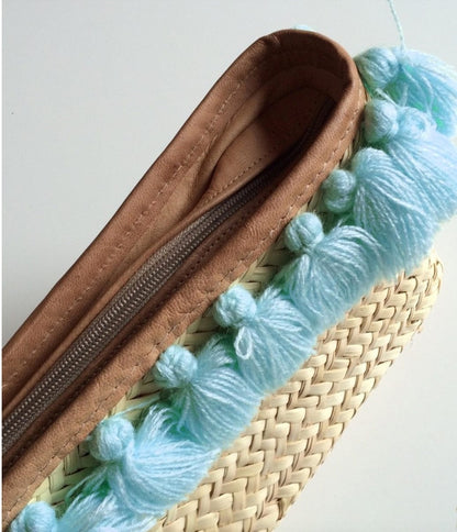 Straw Clutch Bag With  Blue Pom Poms